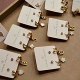 Conjunto de Brincos, Argolinha com Inicial, Pingente Madrepérola e Ponto de Luz